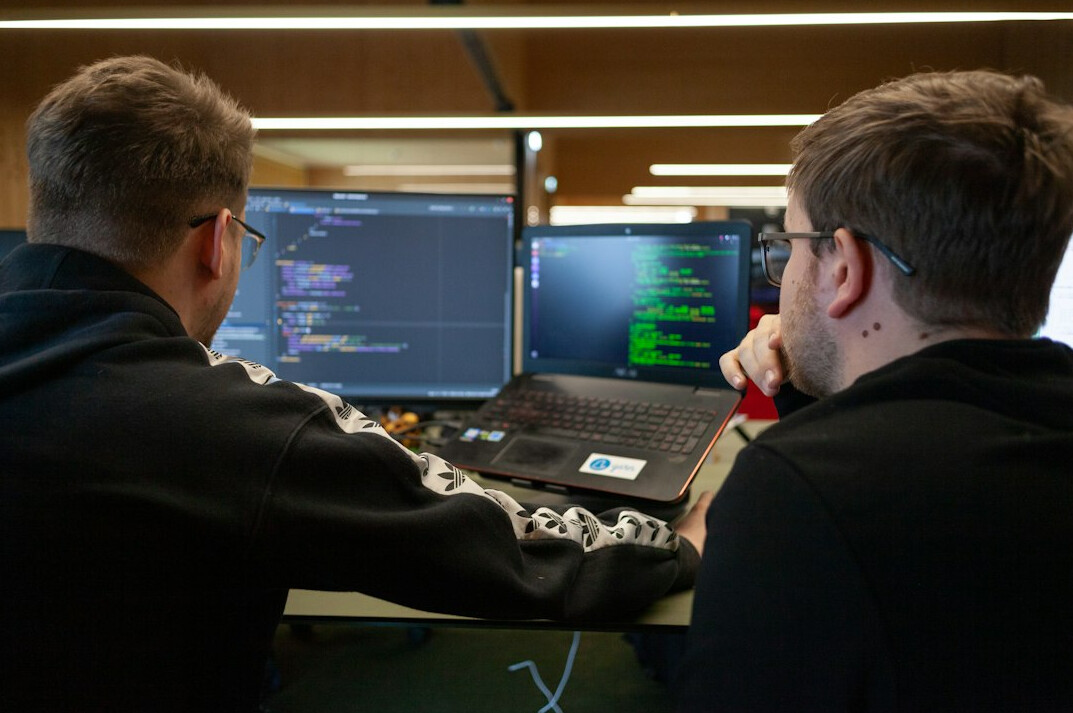 team reviewing code together
