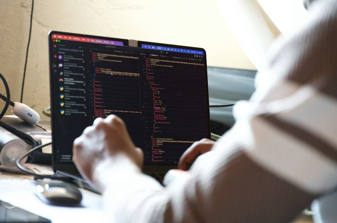 woman coding on computer