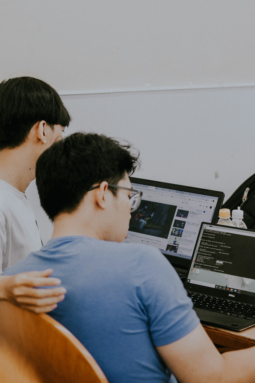 students working on practical coding projects