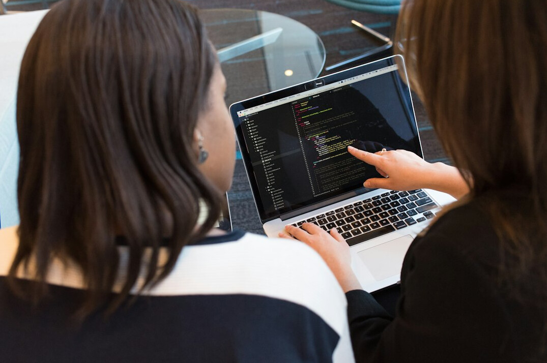 coding mentor helping student