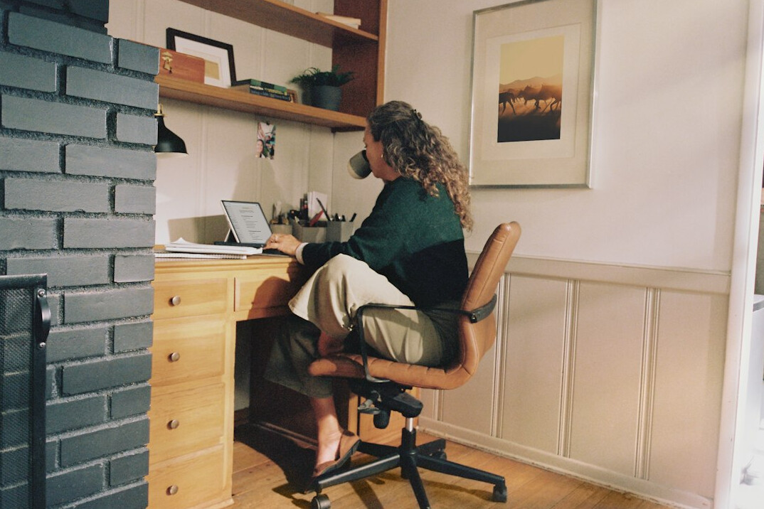person working on laptop at home