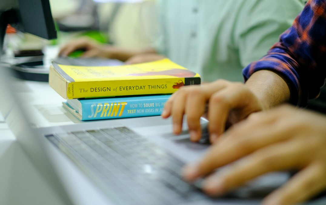 person studying programming books