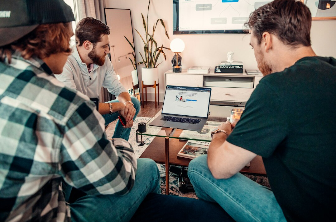 group of students discussing code